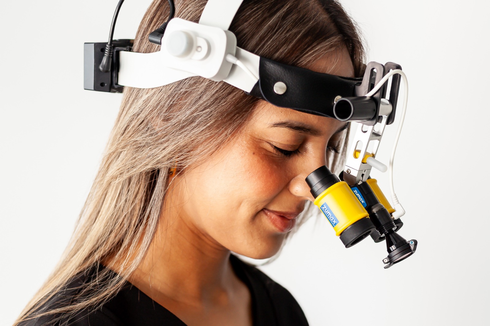 Dr Natalie Lovell wearing dental magnification loupes